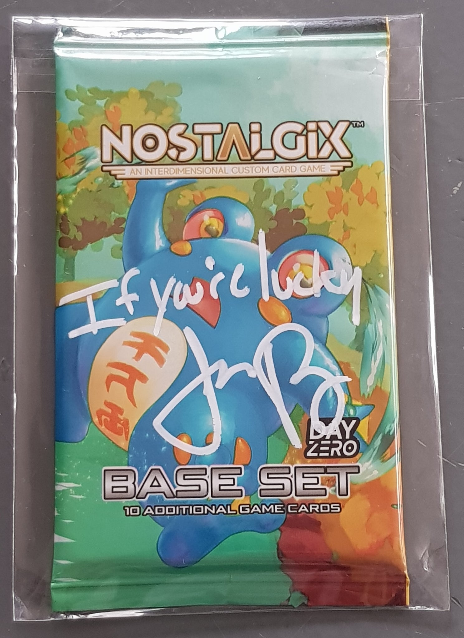 Nostalgix TCG Base Set - Day Zero Sealed Trading Card Booster Pack (Signed by Jason Paige)