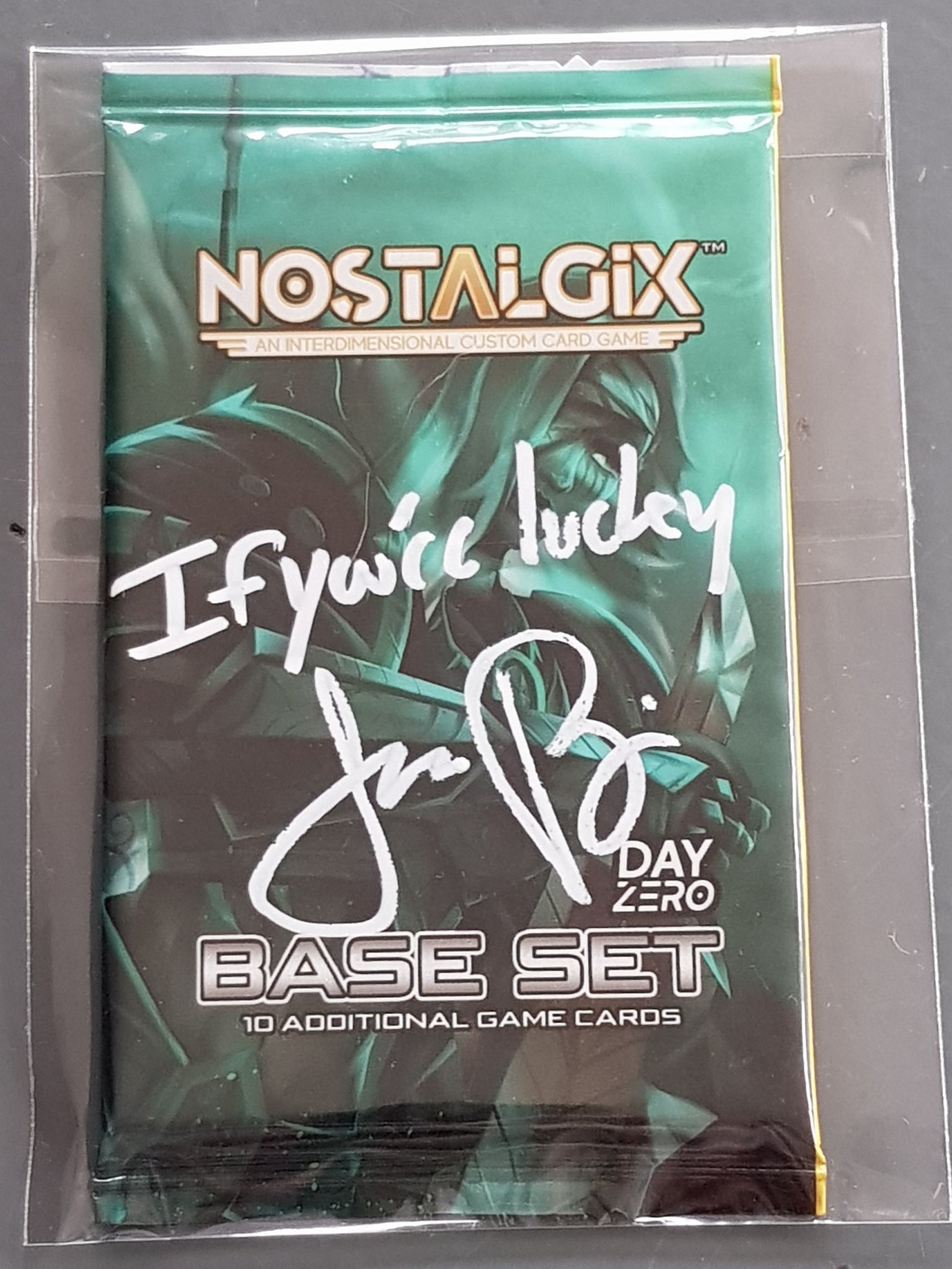 Nostalgix TCG Base Set - Day Zero Sealed Trading Card Booster Pack (Signed by Jason Paige)