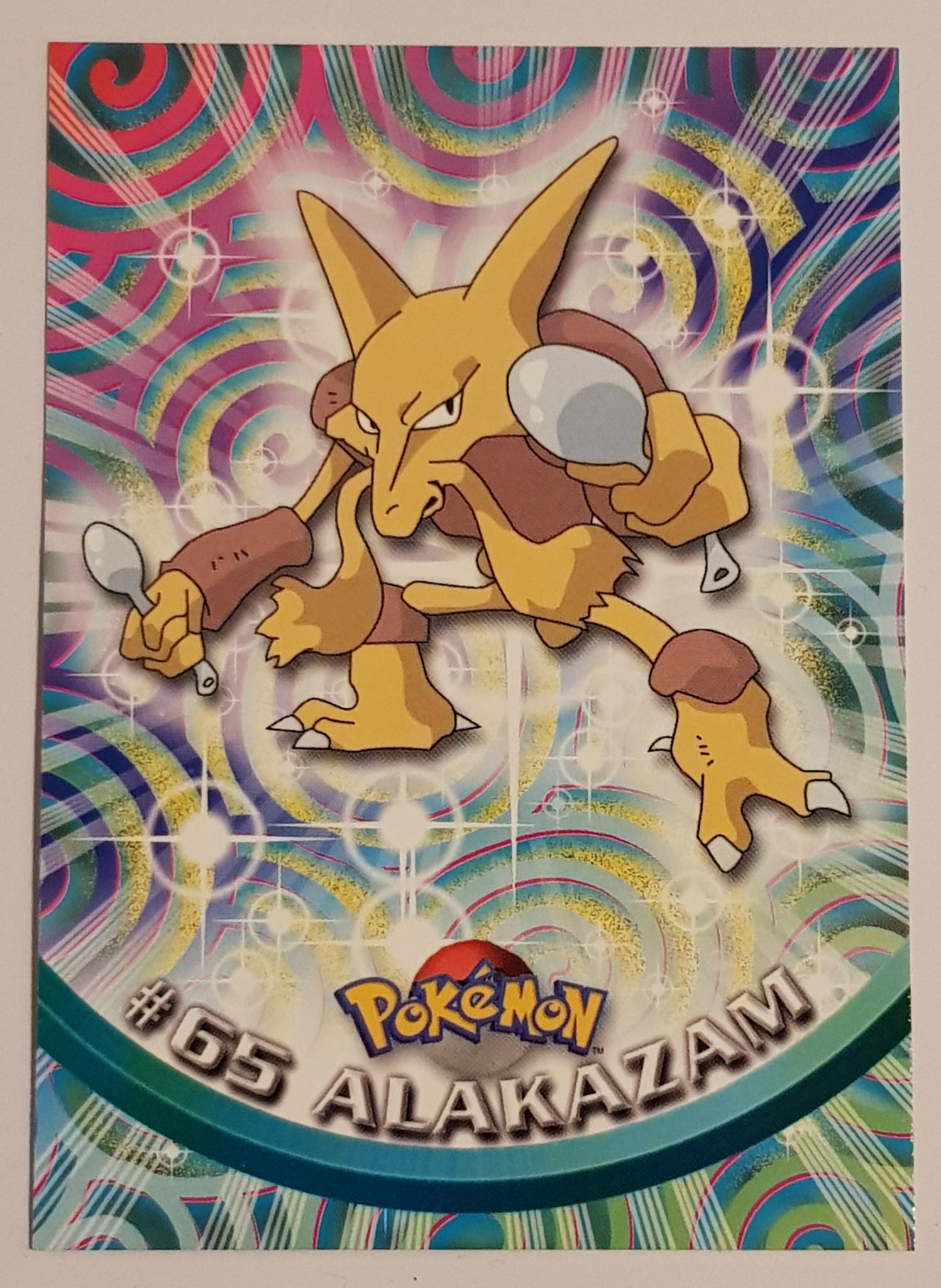 1999 Topps Pokemon TV Animation Series 1 Alakazam #65 Base Trading Card (Blue Logo)