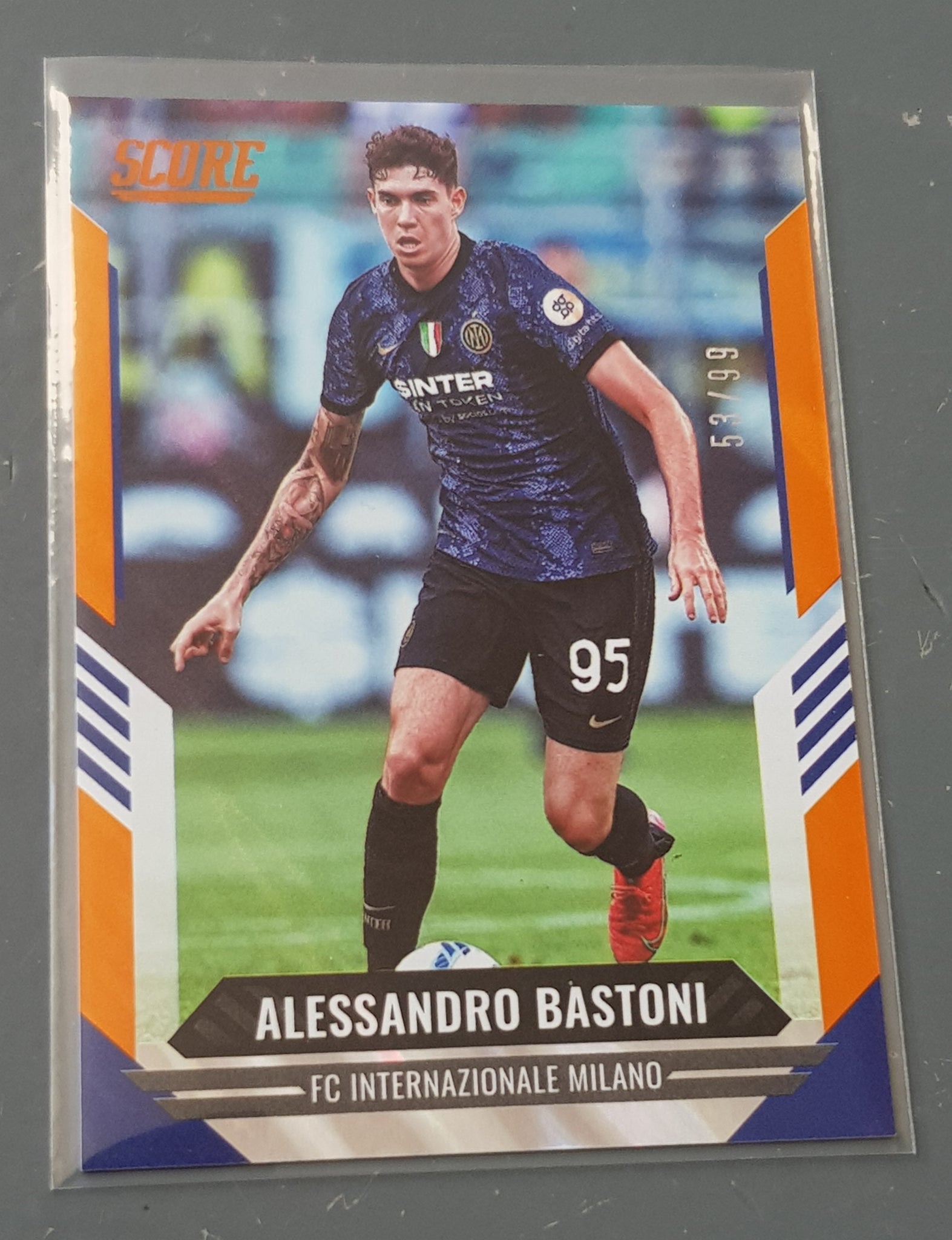2021-22 Panini Score FIFA Alessandro Bastoni #189 Orange Lava Parallel /99 Trading Card