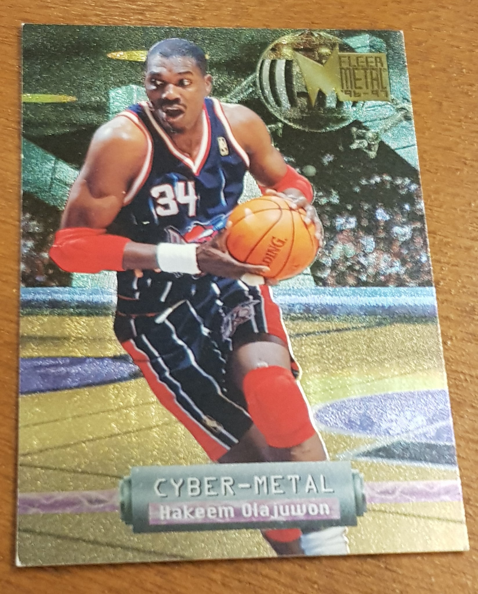 1996-97 Fleer Metal Basketball Cyber-Metal Hakeem Olajuwon #12 Trading Card